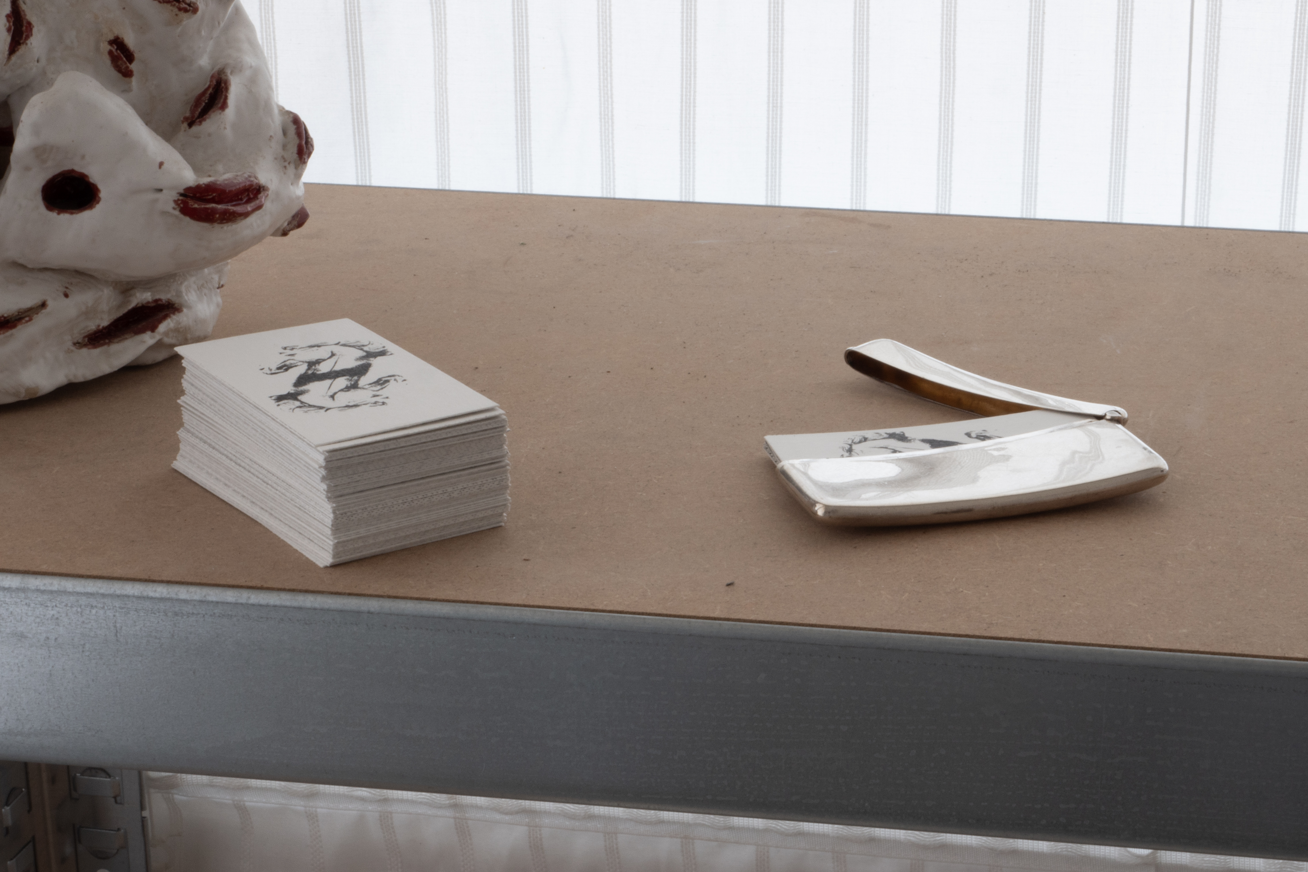 a stack of cards, and cards in a case